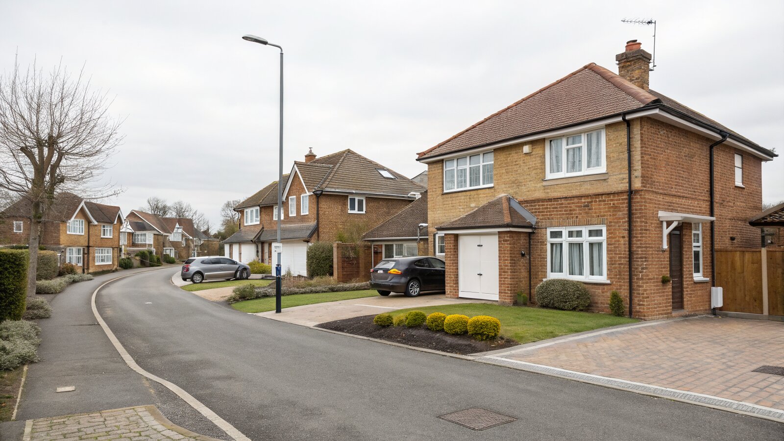 Residential street of brick houses with driveways in a Kent town