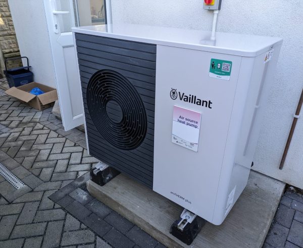 An air source heat pump unit fitted outside a UK home