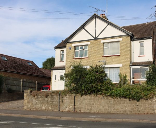 A pair of semi-detached houses in Maidstone, Kent, fitted with white uPVC replacement windows