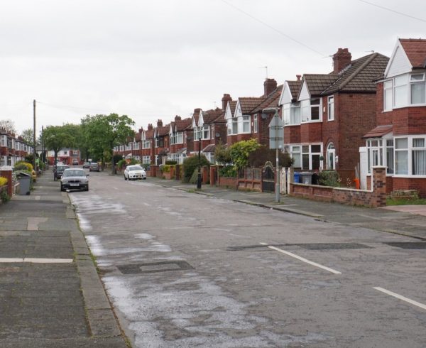 A street of 1930s suburban semi-detached houses in England