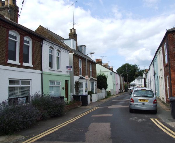 A street of terraced houses in Whitstable, Kent, with a mix of original and replacement windows